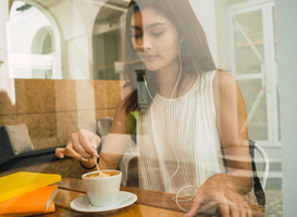 Normal_young-woman-drinking-a-cup-of-coffee-at-coffee-sho-2022-02-02-03-58-33-utc