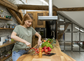 Normal_happy-young-woman-cooking-delicious-and-healthy-fo-2022-04-07-20-47-39-utc