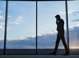 Normal_mature-businessman-with-smartphone-in-a-hotel-2022-03-30-20-23-44-utc__1_