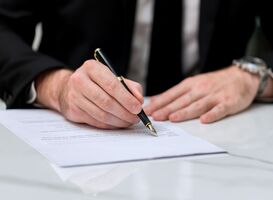 Normal_business-man-approve-sign-on-business-document-bu-2022-11-17-12-29-47-utc__1_