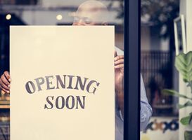 Normal_man-putting-on-store-opening-soon-sign-2022-12-15-23-49-47-utc__1_