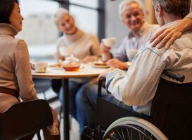 Normal_senior-people-visiting-friend-in-wheelchair-2022-11-28-18-45-20-utc__1_