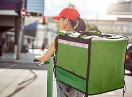 Normal_food-courier-on-scooter-carrying-food-delivery-bag-2021-12-23-00-22-16-utc__1_