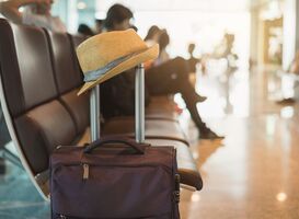 Normal_travel-suitcase-in-airport-terminal-2021-10-06-09-49-55-utc__1_